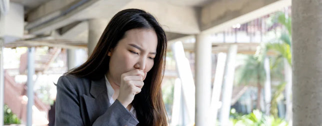 Woman coughing