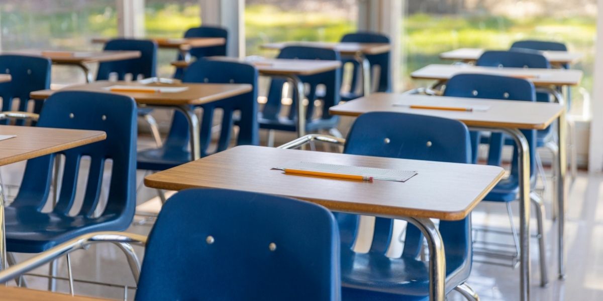 Classroom with empty desks and chairs
