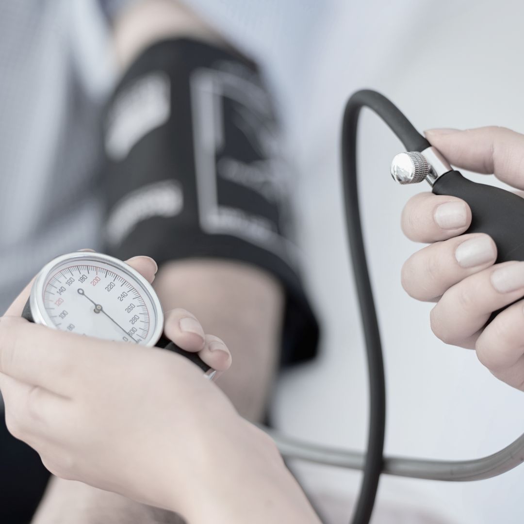 Person having their blood pressure taken with a sphygmomanometer.