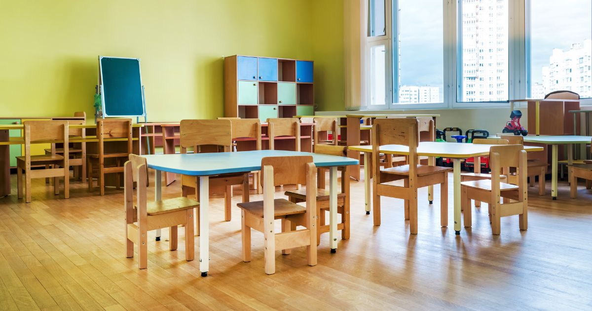 Empty tables and chairs in a kindergarten classroom 