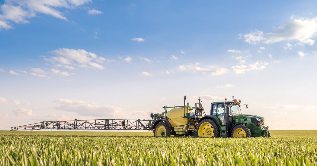 Combine harvester in field on a sunny day