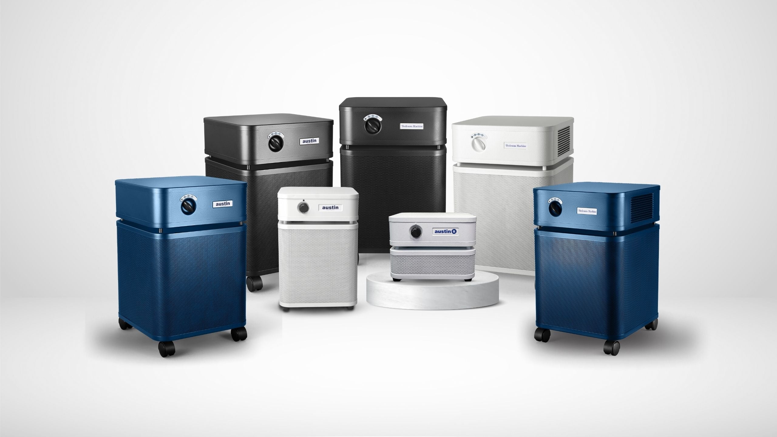Collage of various colored Austin Air standard, junior, and personal air purifiers in real-life home and office environments.