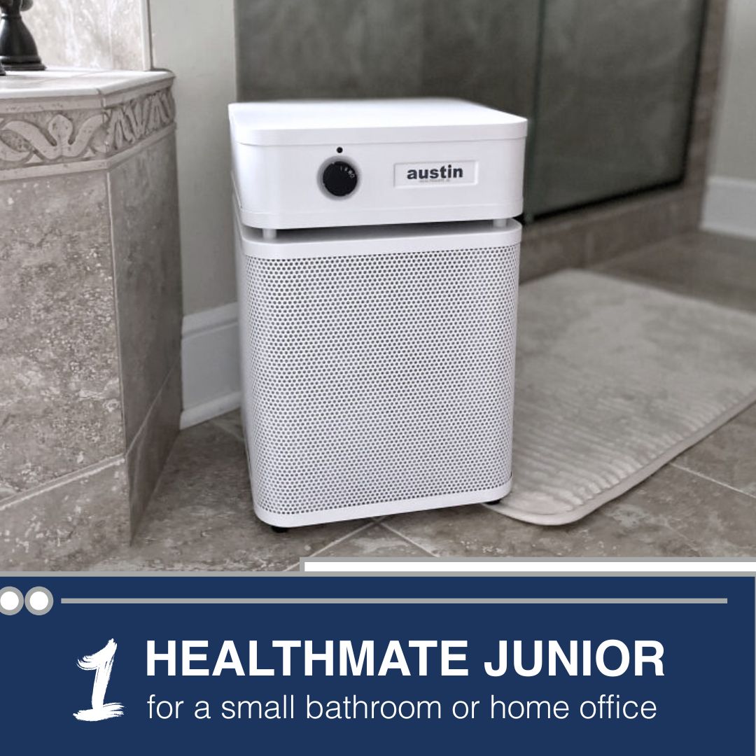 Air purifier labeled 'austin' in a bathroom setting with text 'Healthmate Junior'.