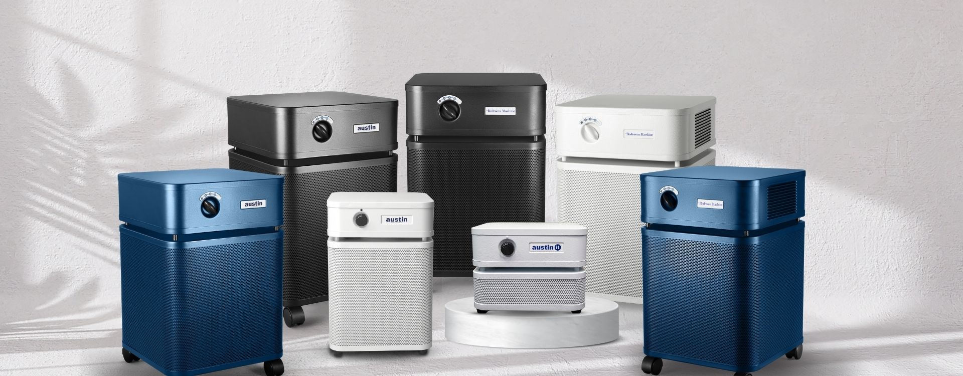 Collection of various Austin Air purifiers on a white background