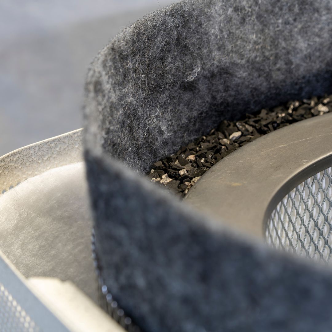 Close-up of an Austin Air filter with prefilters and granulated carbon visible