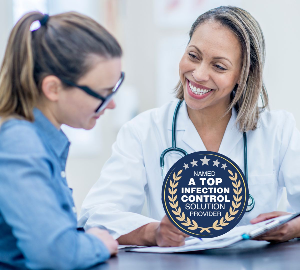Doctor and patient talking with a badge indicating top infection control solution provider.