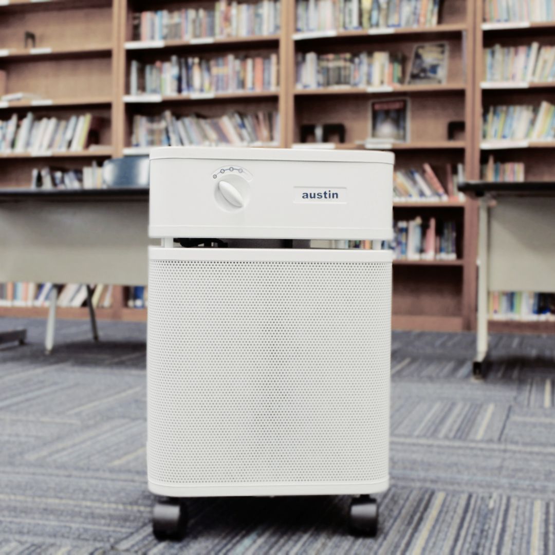 White Austin air purifier in a school library setting