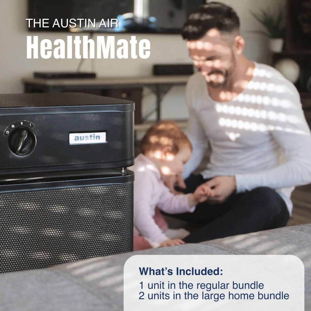 Austin Air HealthMate air purifier with a man and child in a home setting