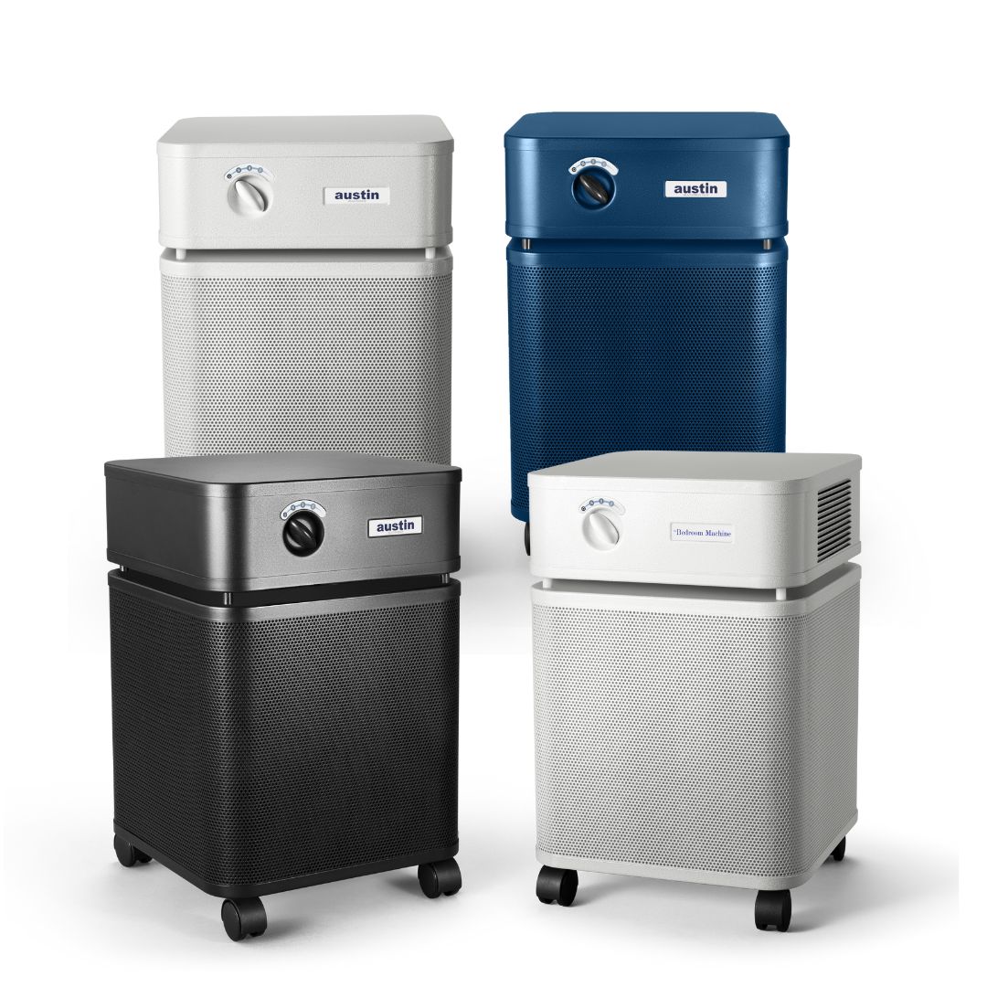 Four Austin Air cleaners in different colors on a white background