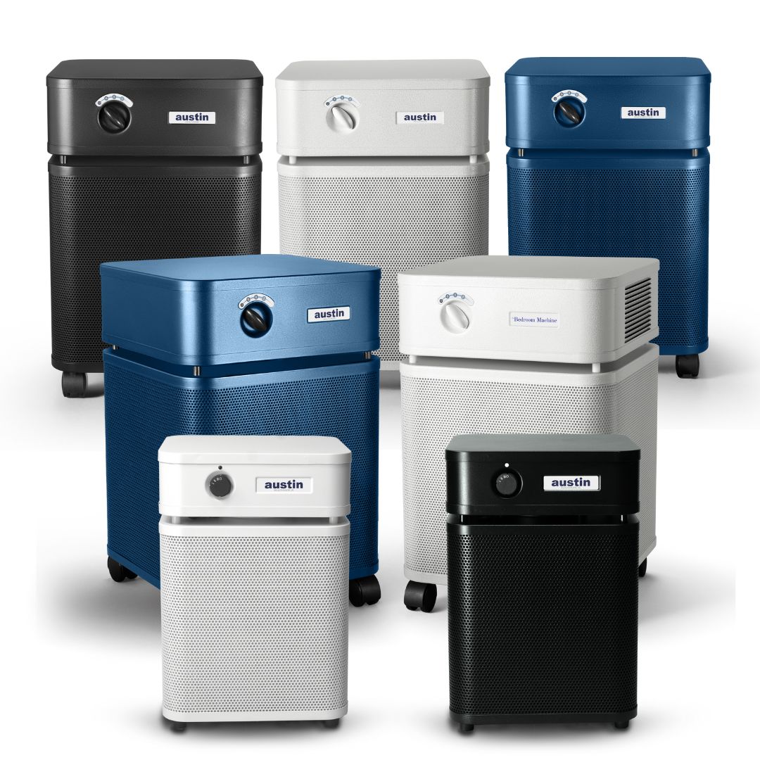 Collection of Austin air purifiers in various colors on a white background