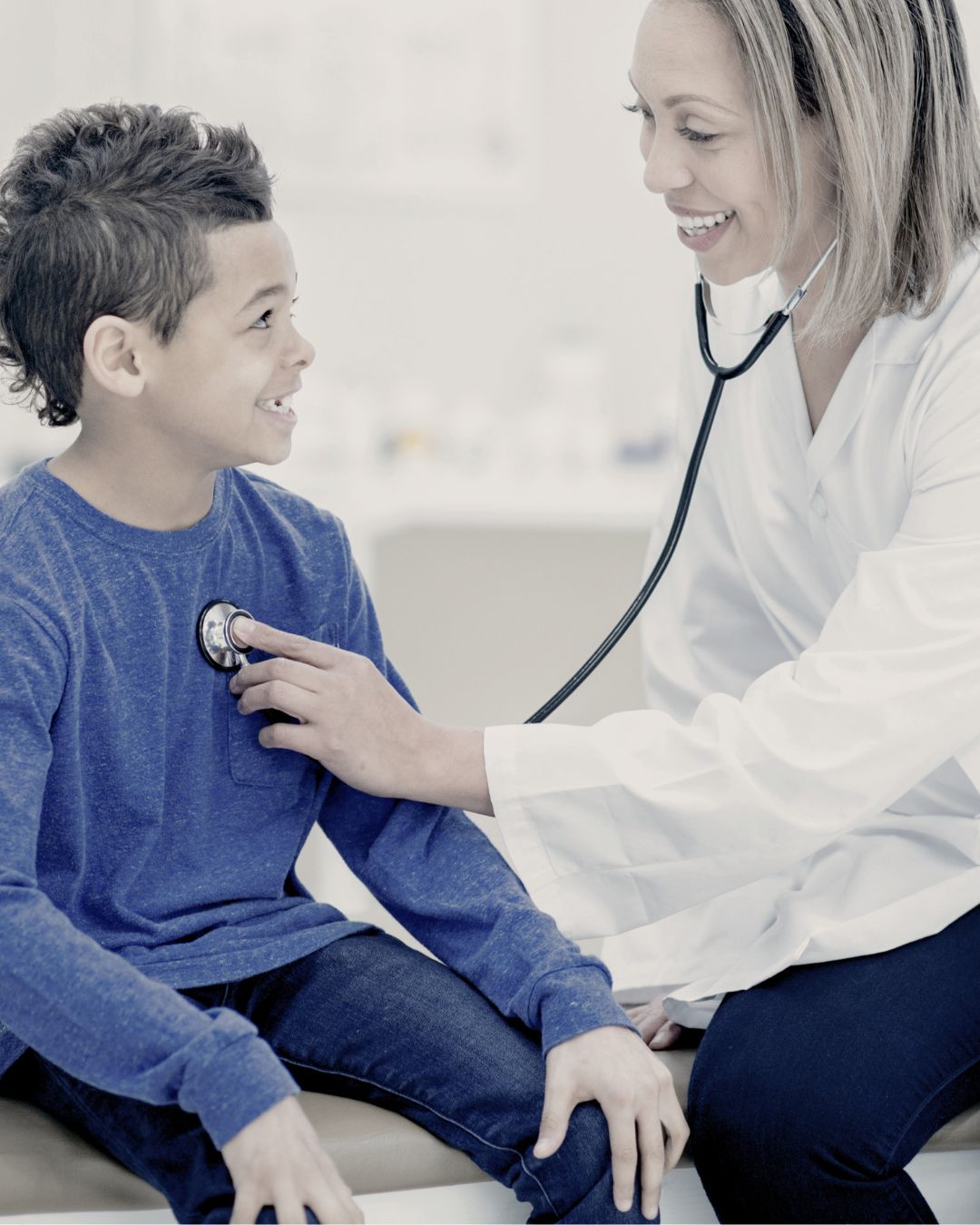 a doctor checking the heartbeat of a child