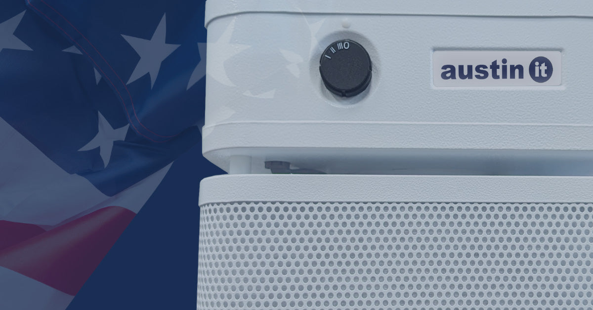 White air purifier with 'austin it' branding on a blue background with American flag elements.